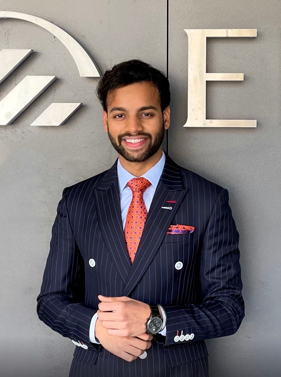 Sarthak smiling in the Swiss snow